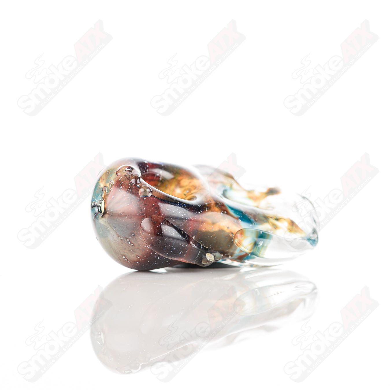 Glass pipe called Donut Chillum by Nobody, featuring a clear glass design with a donut-shaped bowl and intricate detailing.