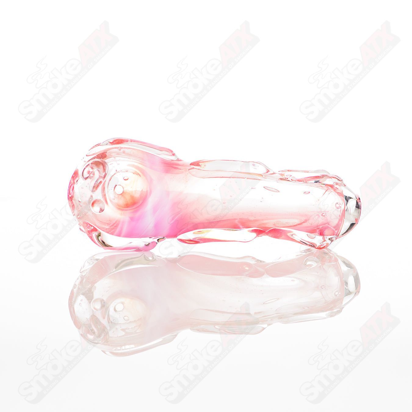 Glass pipe with spoon shape, labeled as #37 Spoon Glass by Nobody, featuring clear glass construction and smooth curved design.