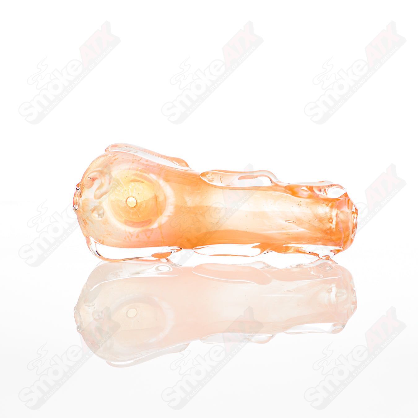 Spoon-shaped glass pipe by Nobody featuring clear glass with smooth curves, designed for smoking.