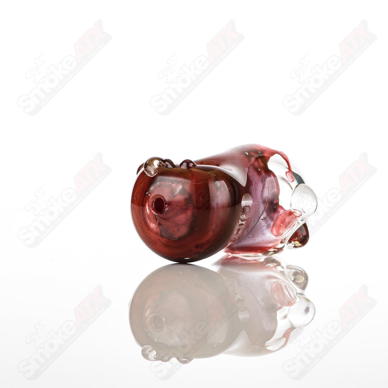 Clear glass bean-shaped spoon pipe by Nobody with a smooth, rounded design for easy handling and use.