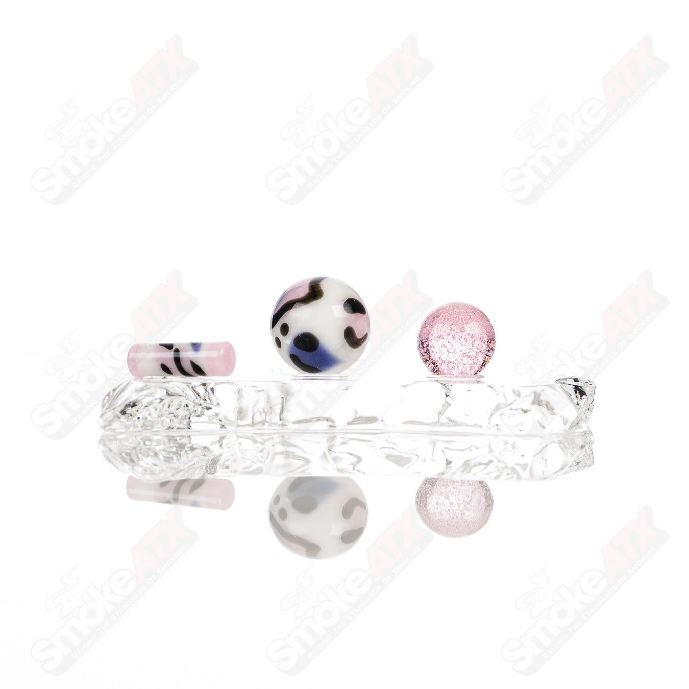 Set of four leopard-themed glass slurper sets from Adventures In Glass Blowing, featuring detailed animal designs and vibrant colors.