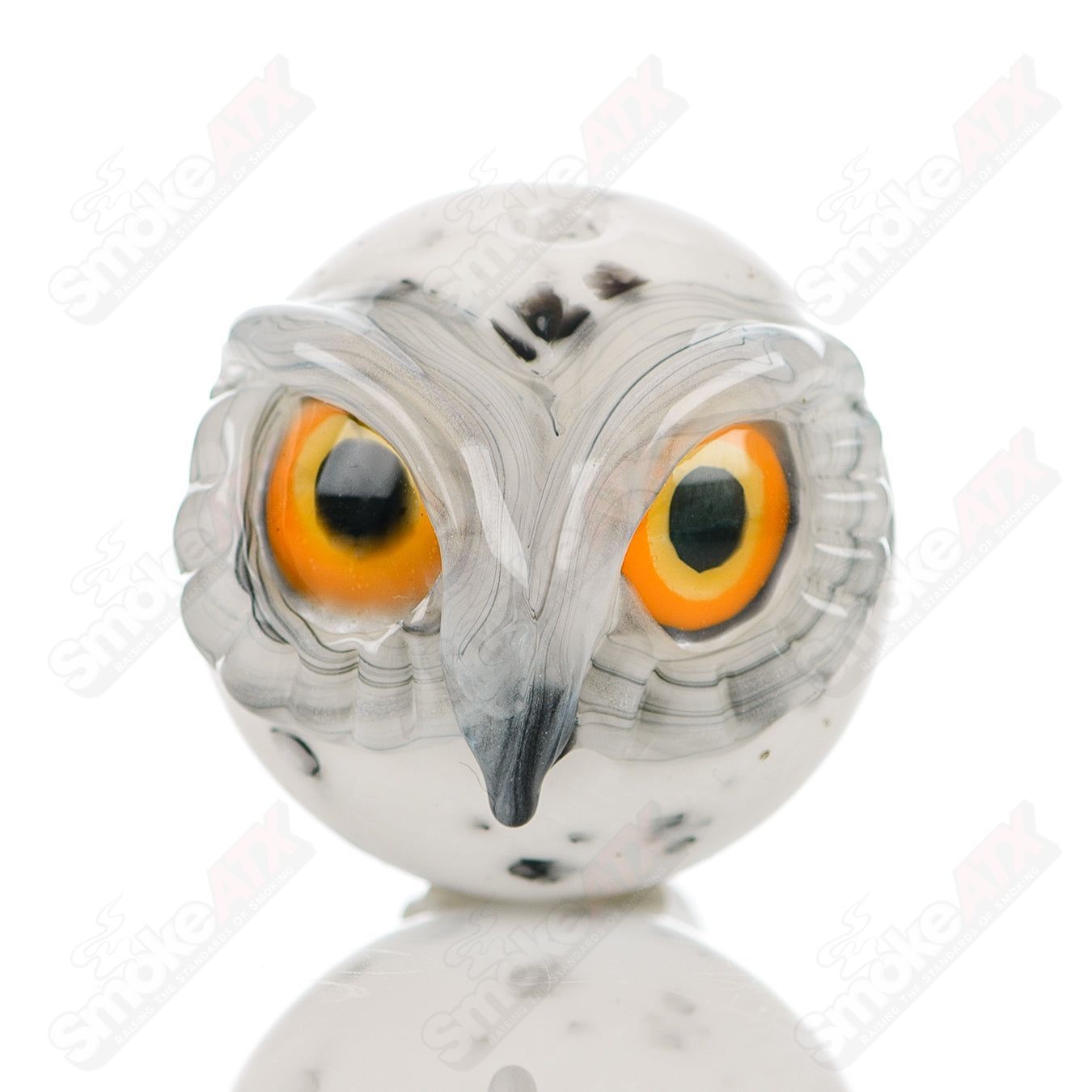 Glass spotted owl carb cap by Four Winds Flameworks, featuring intricate owl design and four wind details for vapor dab rigs.