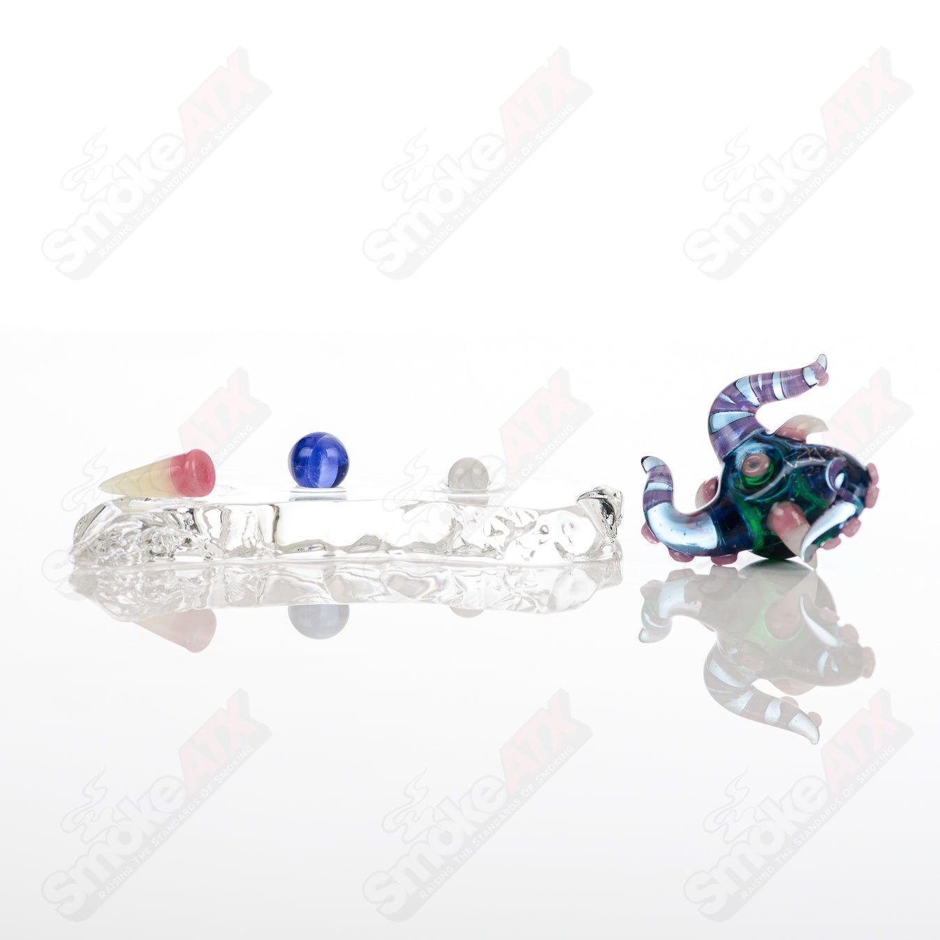 Set of four Salt Glass heady glass slurper pieces featuring Neptune, Plantphibian, and Marina designs for dabbing and concentrates.
