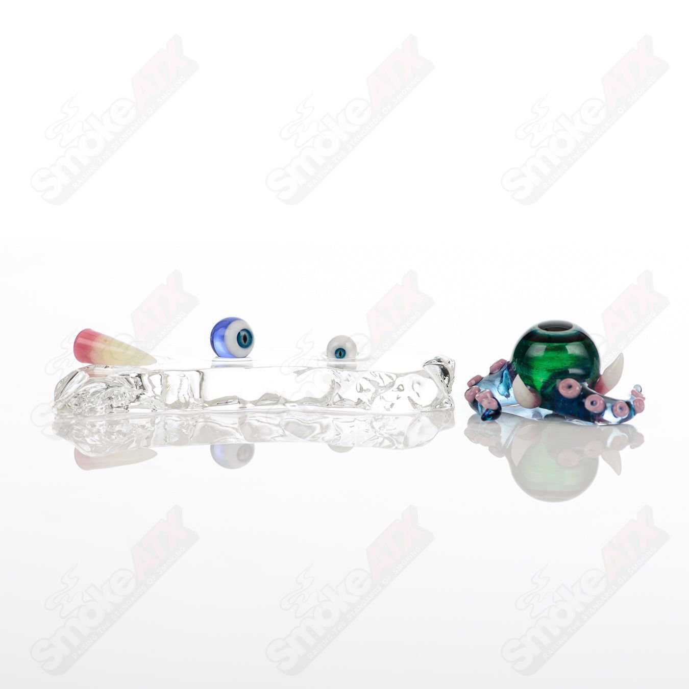 Set of four Salt Glass heady glass slurpers featuring Neptune, Plantphibian, and Marina designs, perfect for concentrates.