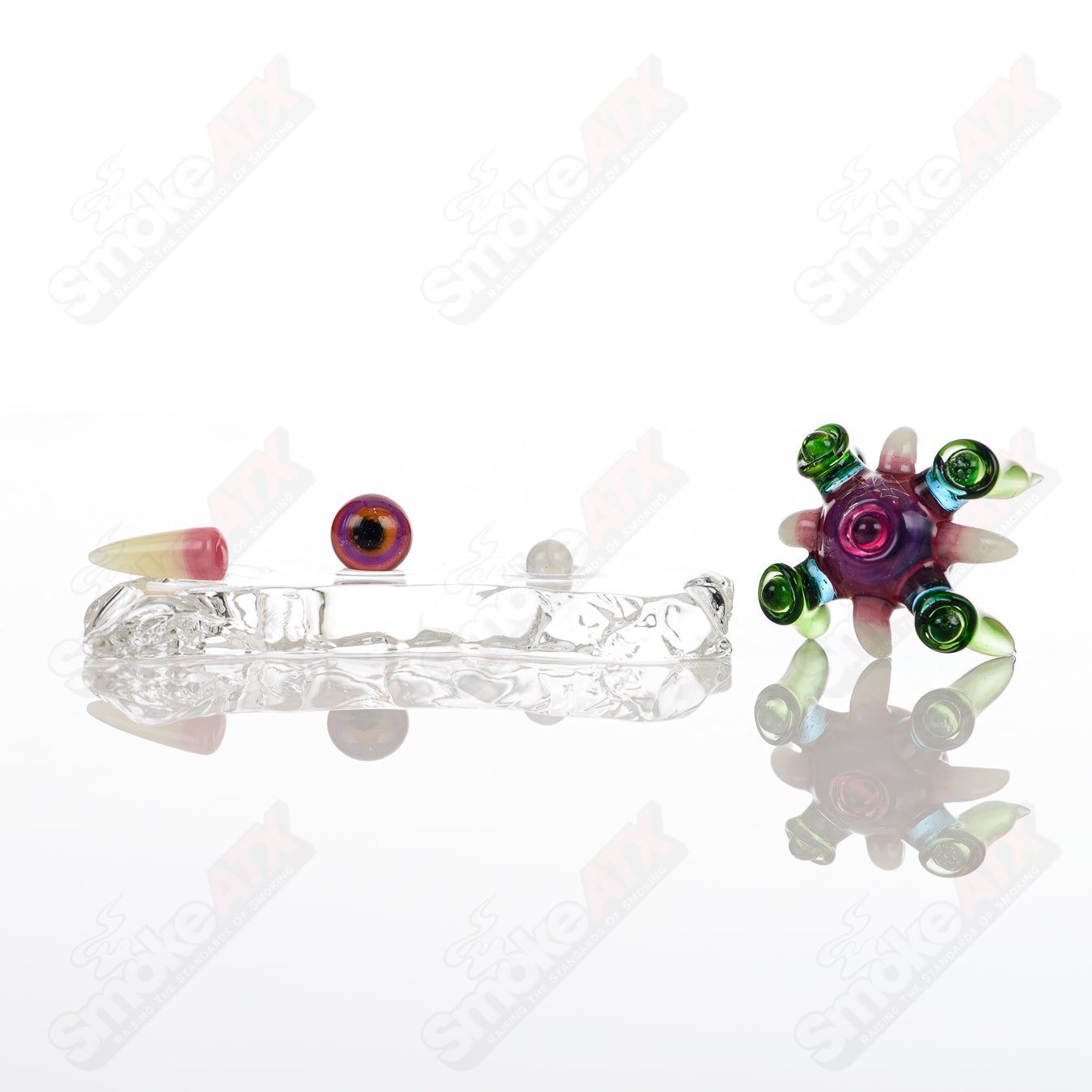 Four-piece UV Slurper Set by Salt Glass featuring Royal Jelly, Lucy, Atomic Stardust, Plantphibian, and Citrine heady glass pieces.