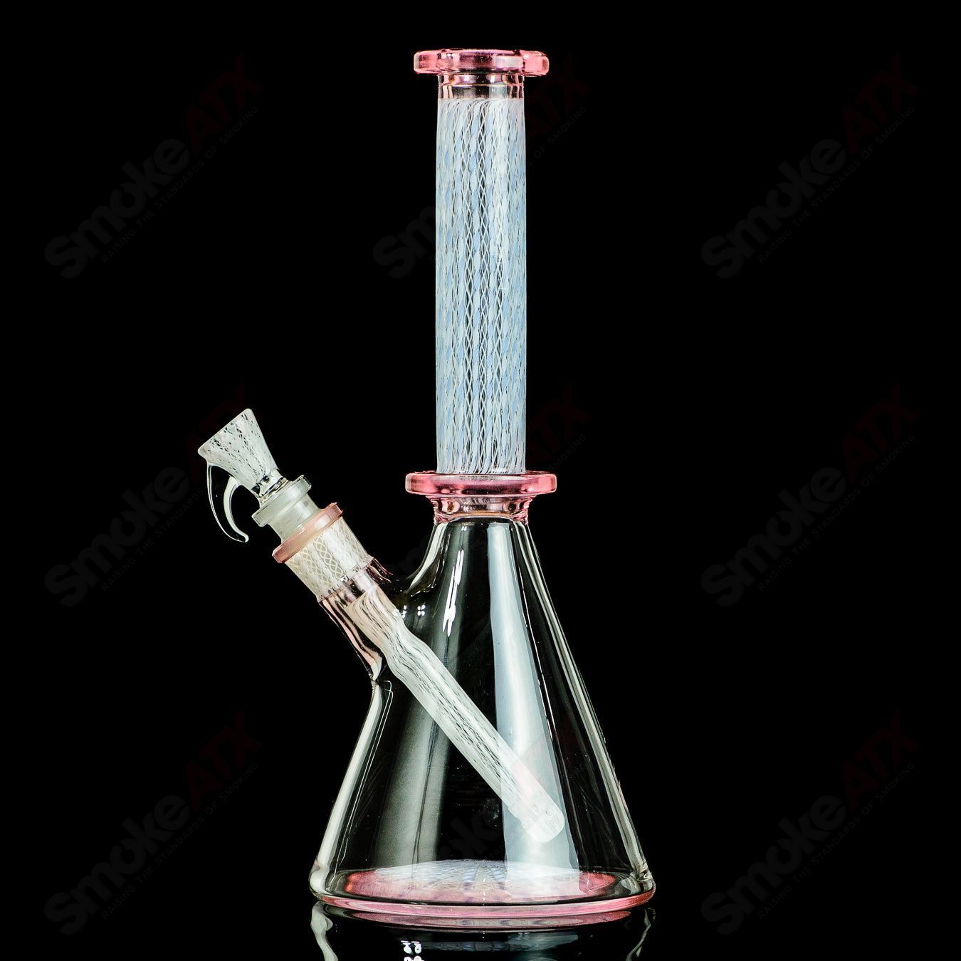 Heady glass beaker by Steven Pierce Glass and Harold Cooney, featuring colorful artistic design and clear glass construction.
