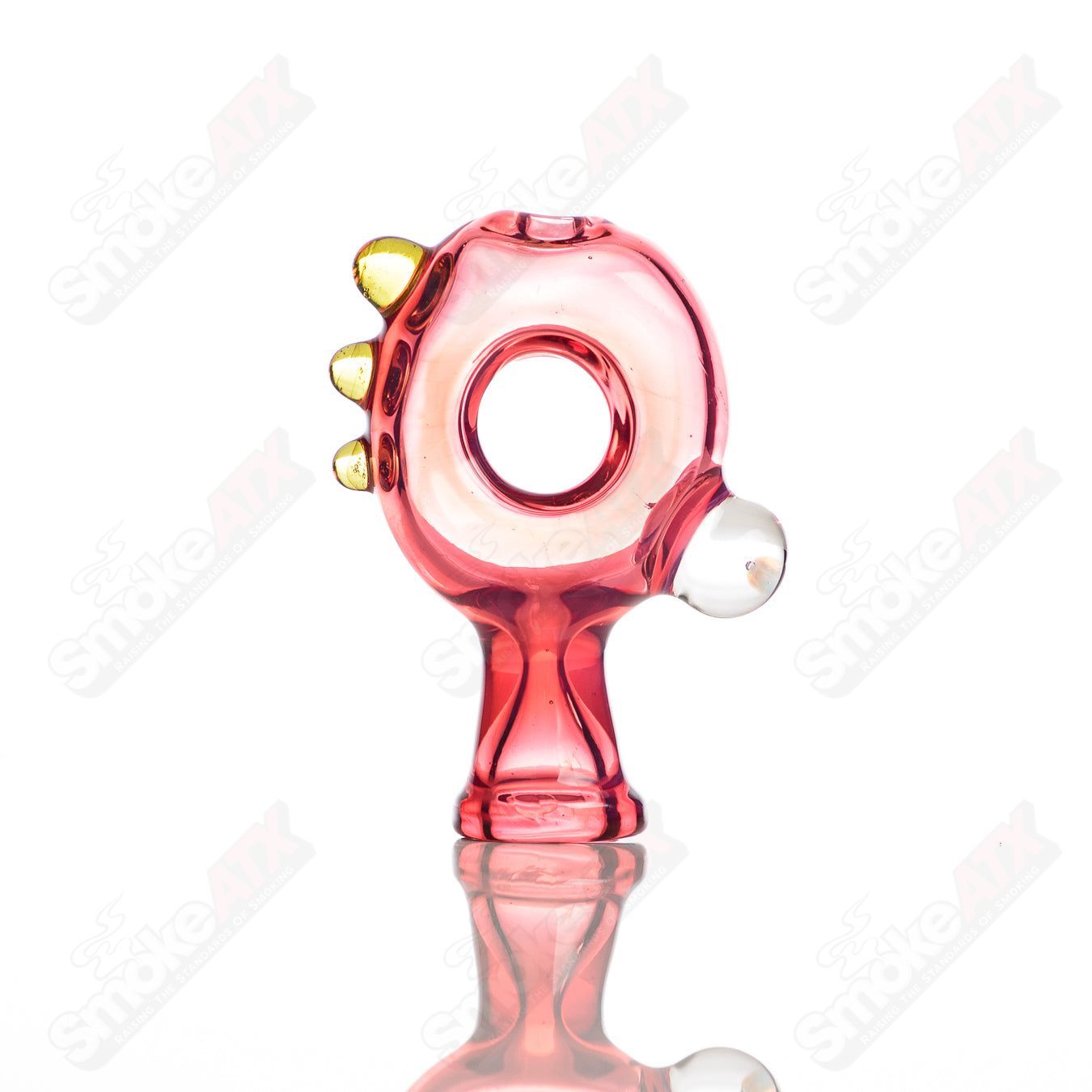 Large glass donut chillum by Baby Dabs, a colorful and detailed smoking pipe featuring a donut design for dabbing and smoking.