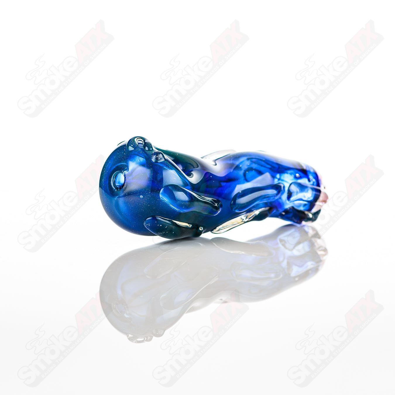 Glass pipe called #5 Spoon by Nobody, clear glass with a smooth bowl and elongated stem, designed for smoking.