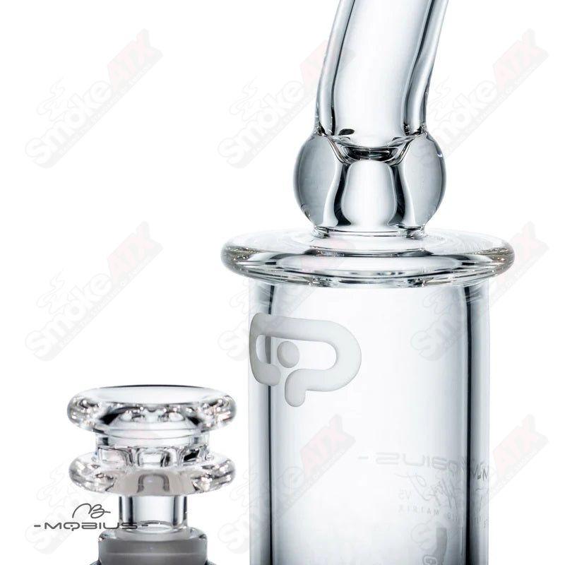 Glass waterpipe with 50T V5 Stereo Matrix design by Mobius, featuring intricate glasswork and a sleek, modern shape.