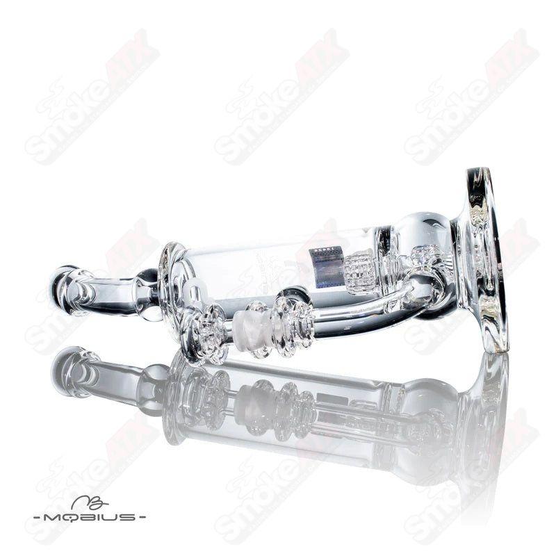 Glass waterpipe with 50T V5 Stereo Matrix design by Mobius, featuring intricate glasswork and clear tubing for smooth hits.