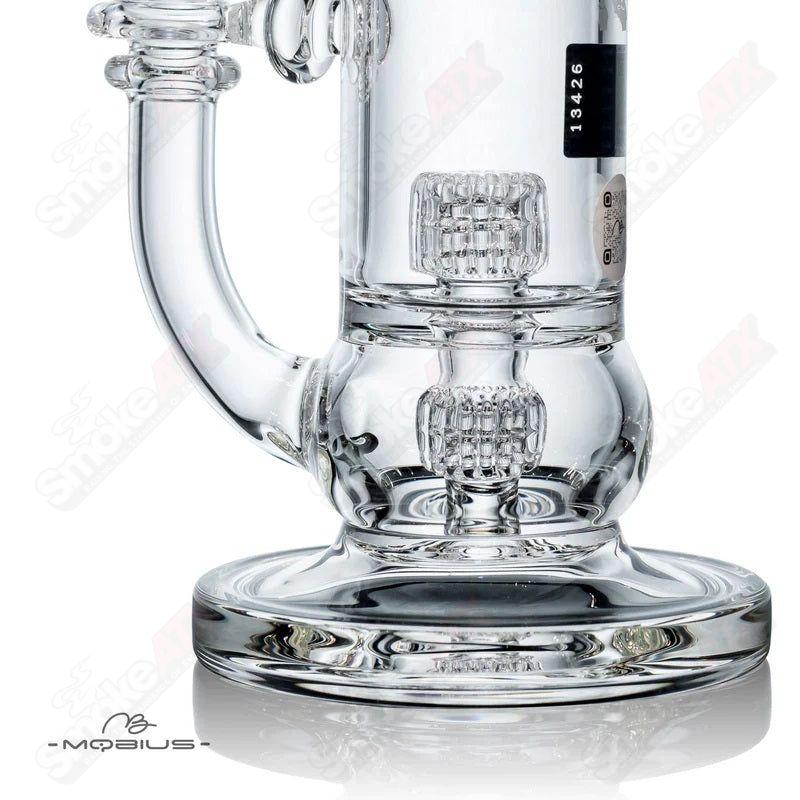 Glass waterpipe with 50T V5 Stereo Matrix design by Mobius, featuring intricate glasswork and a sleek, clear waterpipe body.