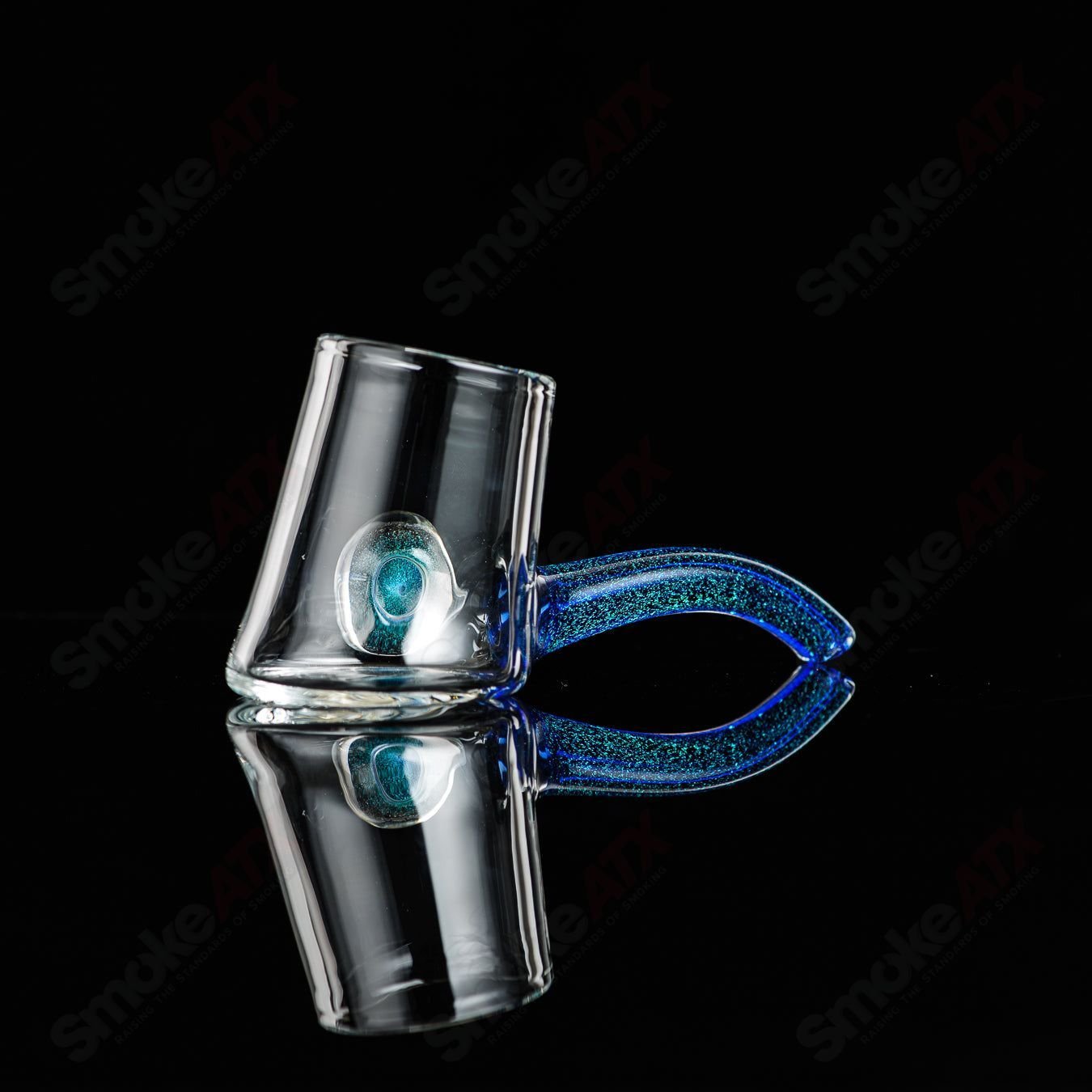 Justin Freeman 6 Dichro Proxy Attachment made of glass, showcasing colorful, reflective glass accessories for jewelry or art projects.