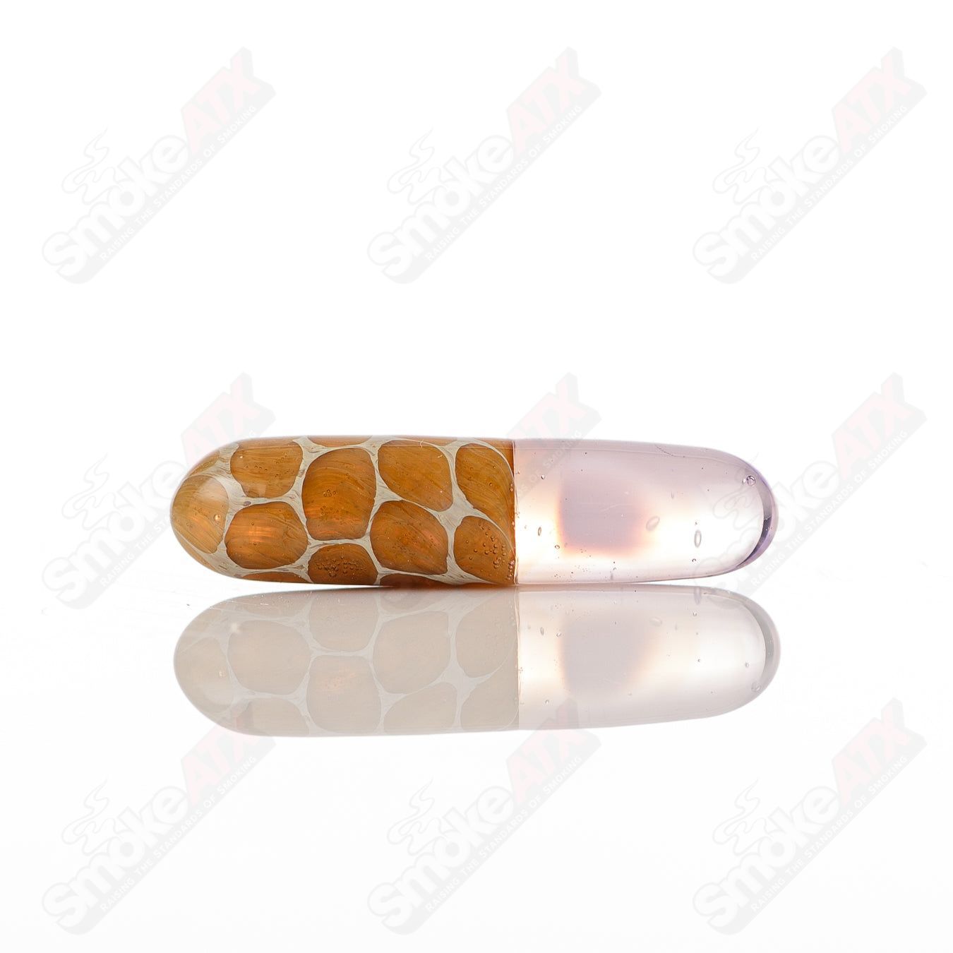 Close-up of a Robertson Glass #6 Terp Pill by 710 Products, showcasing its clear glass design and compact shape.