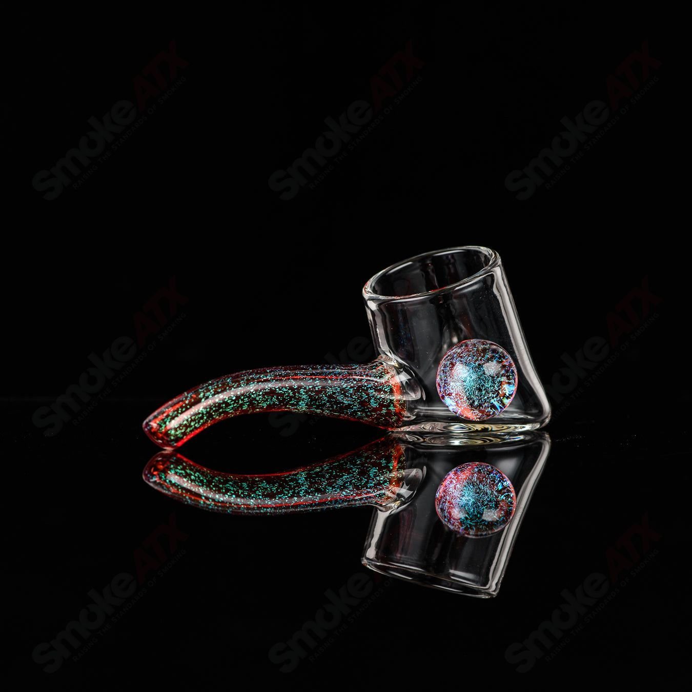Justin Freeman 9 Dichro Proxy Attachment made of glass, a colorful decorative accessory for glass art and craft projects.