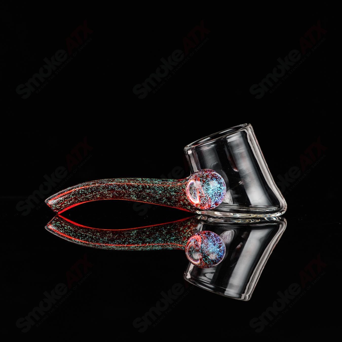 Justin Freeman 9 Dichro Proxy Attachment made of glass, showcasing colorful, reflective dichroic glass accessory for jewelry or art.