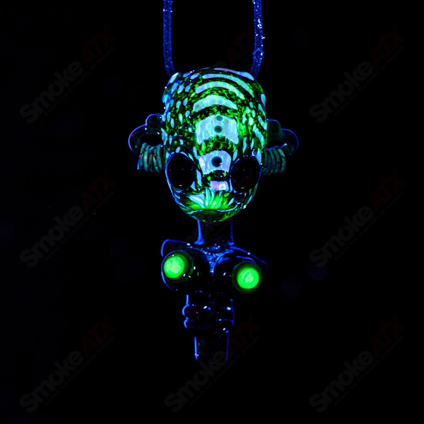Alien Bondage Slave Pendant by Bufo, a Heady Glass pendant featuring an alien figure with bondage details in vibrant colors.