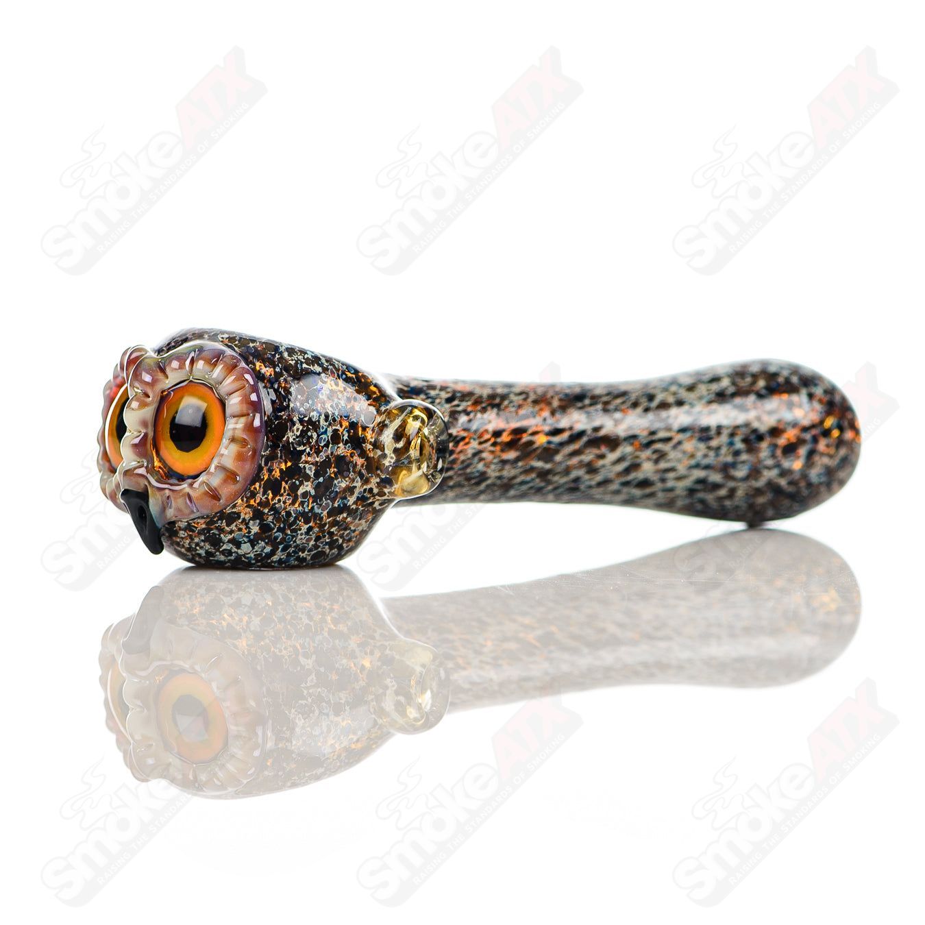 Black spotted owl glass spoon pipe by Four Winds Flameworks, featuring detailed owl design and smooth glass finish.