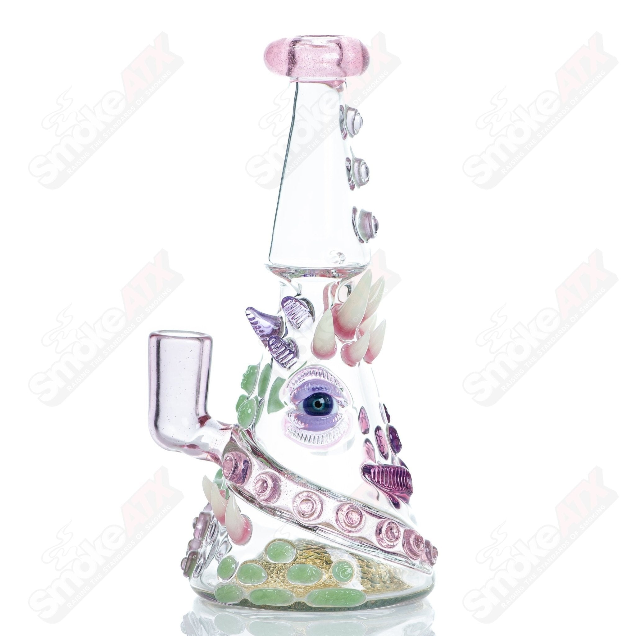 CFL Rip Curl by Helix Salt Glass Heady Glass concentrate rig with colorful rip curl design and intricate glass details.