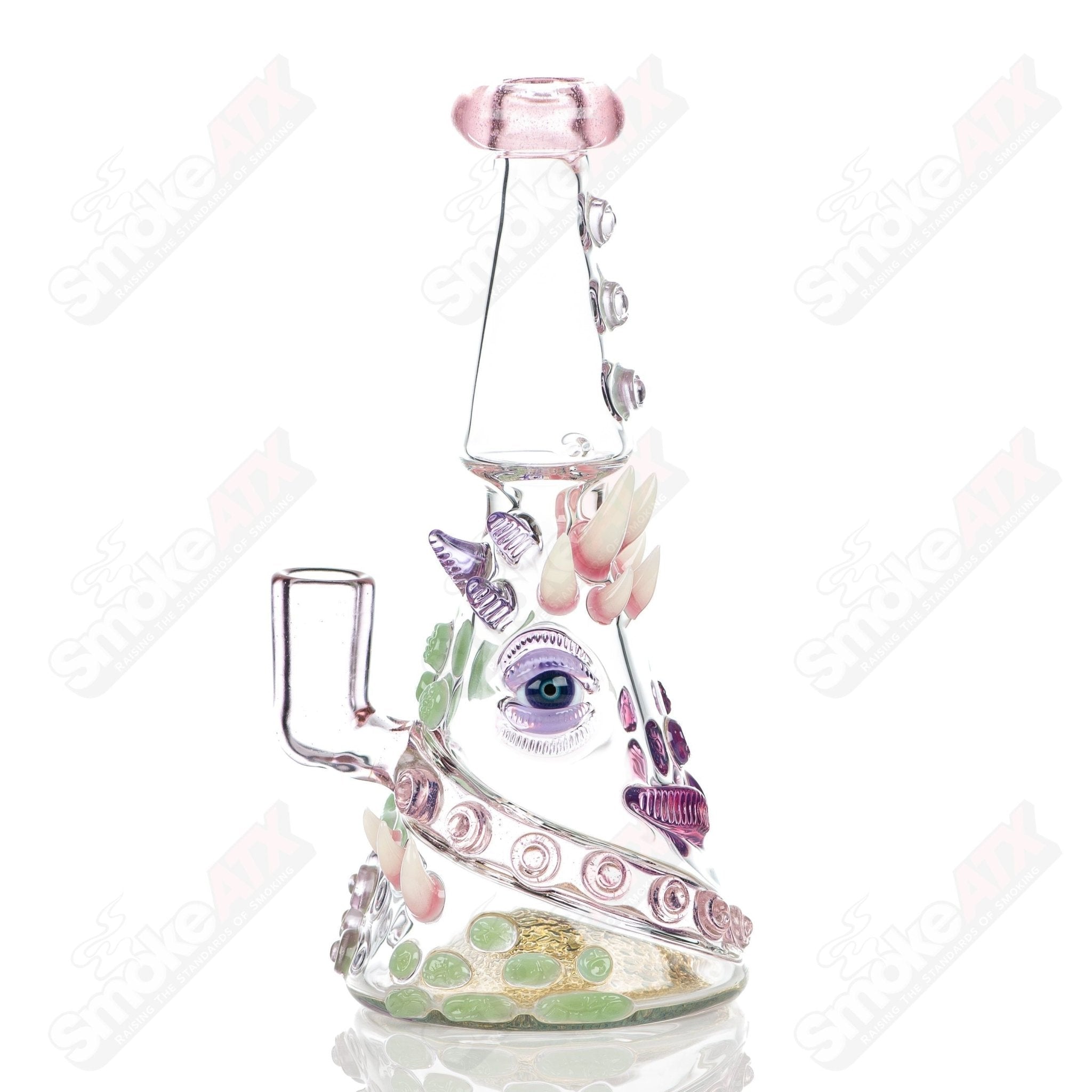 CFL Rip Curl by Helix Salt Glass, a colorful heady glass concentrate rig with intricate design and sturdy glass construction.
