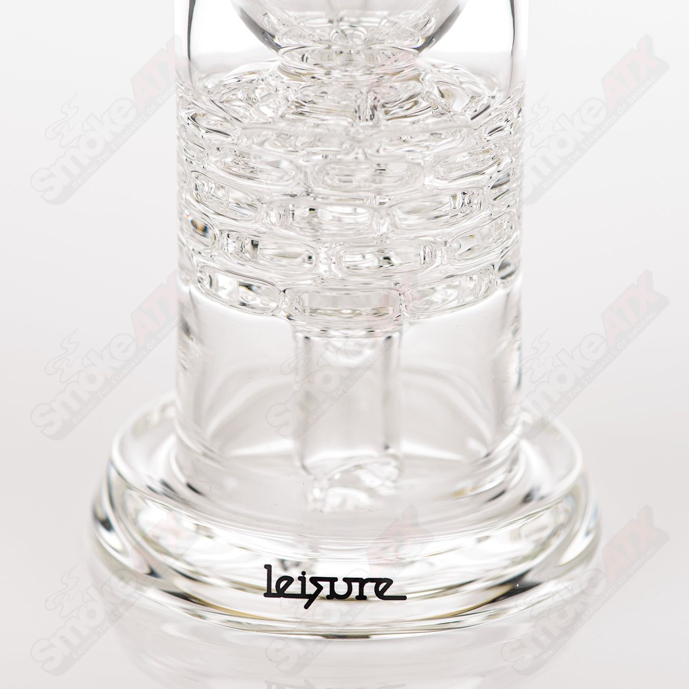 Clear Brickstack Incycler Leisure glass concentrate rig with geometric design, featuring multiple chambers and intricate glasswork.