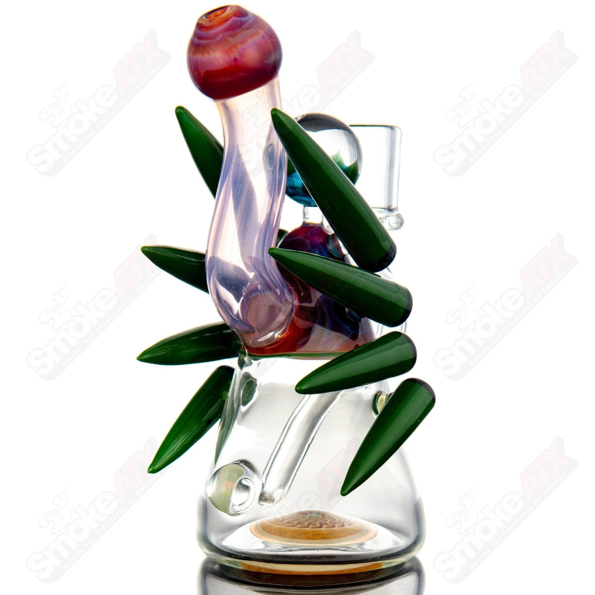 Color accent horned Bub rig by Yunk Glass, a vibrant heady glass concentrate rig with colorful details and intricate design.
