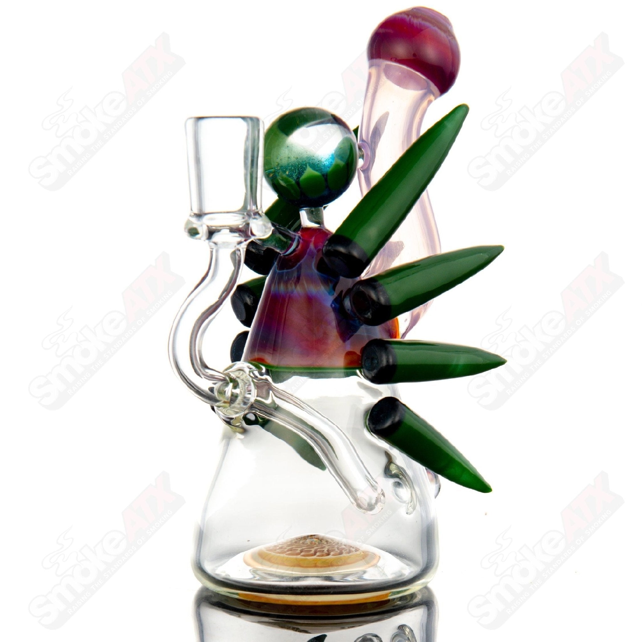 Color accent horned Bub rig by Yunk Glass, a heady glass concentrate rig with vibrant color details and intricate horn design.