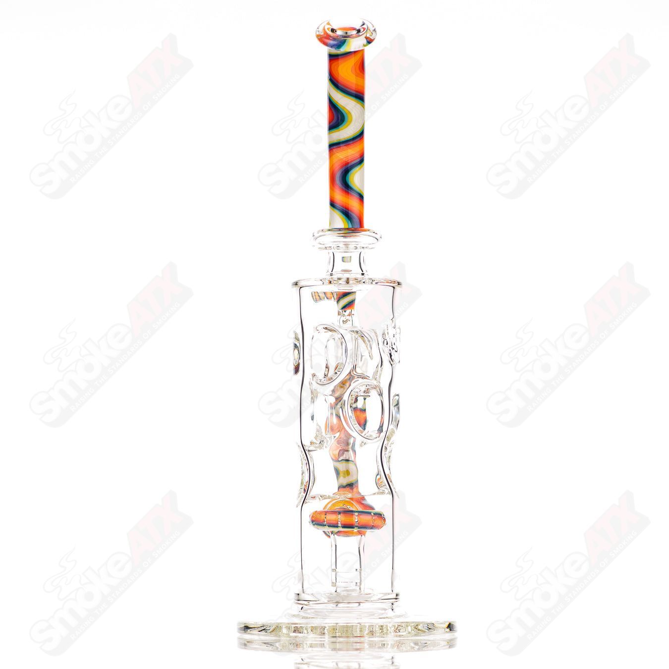 Glass donut-shaped bubbler rig by Texas Hot Glass with a colorful, intricate design and a clear glass bowl attachment.