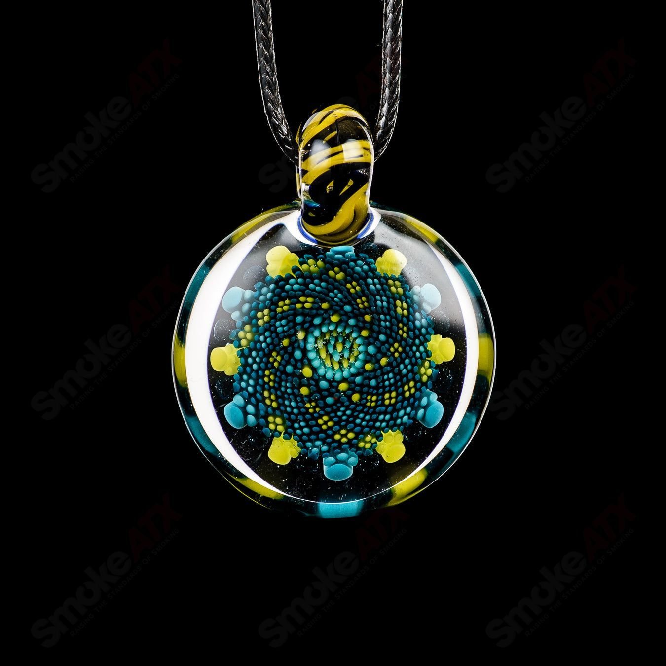 Glass pendant from Kit Kanz Doticello Pendant Kit Kanz, featuring colorful glass design and a silver bail on a white background.