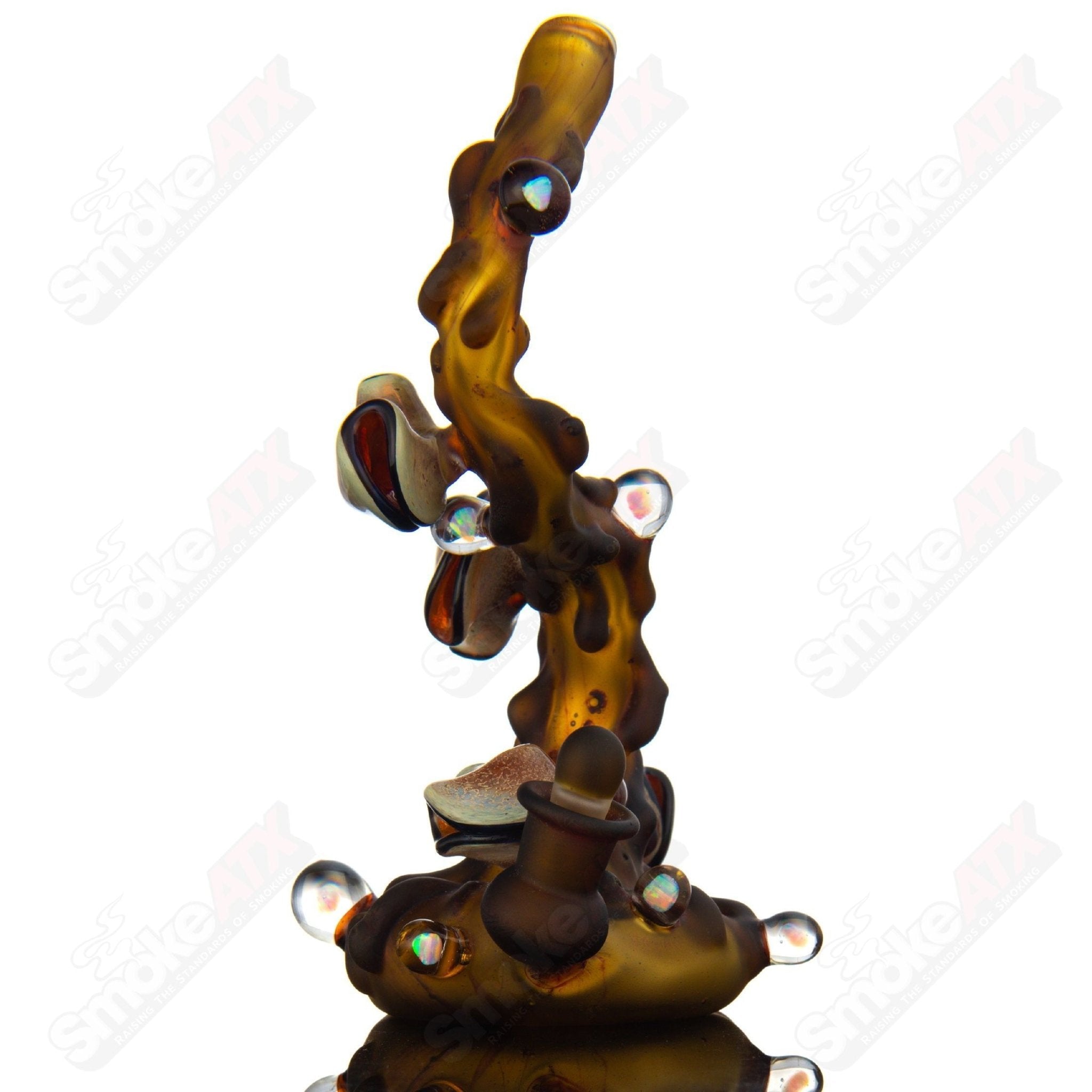 Flowing Tea Rig with teacup design by Dux Glass, clear heady glass concentrate rig featuring intricate flowing patterns and a matching teacup.