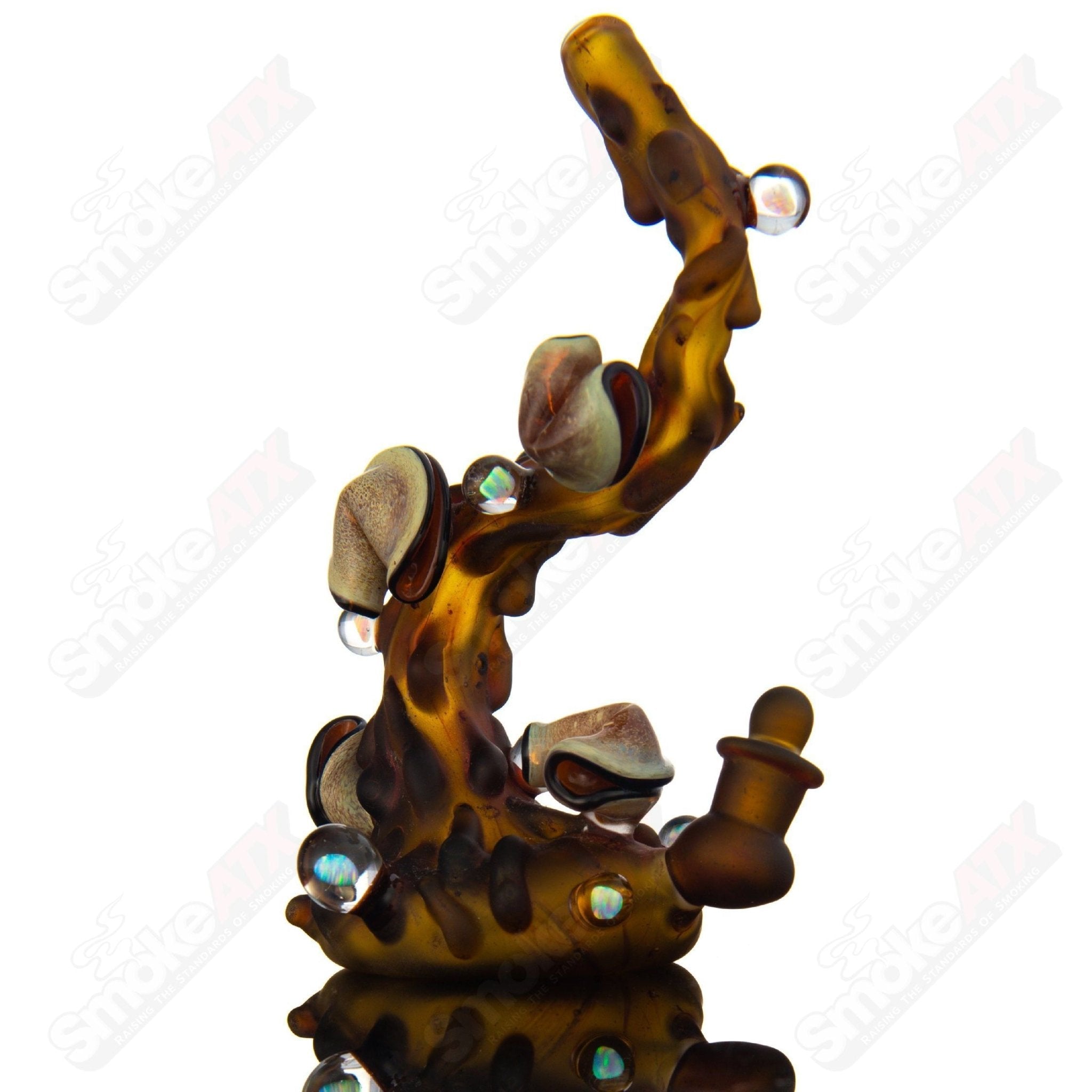 Dux Glass flowing tea rig with a matching teacup, handcrafted heady glass concentrate rig with intricate design details.