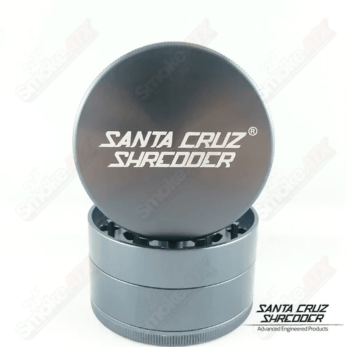 Grey 4-piece large Santa Cruz Shredder metal grinder with textured grip and multiple chambers for grinding and storage.