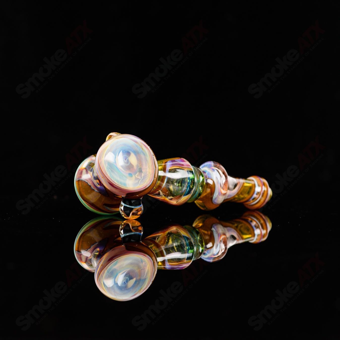 Glass pipe called Hammer Baby Dabs x Gus by Baby Dabs, featuring a clear design with colorful accents and a sturdy hammer shape.