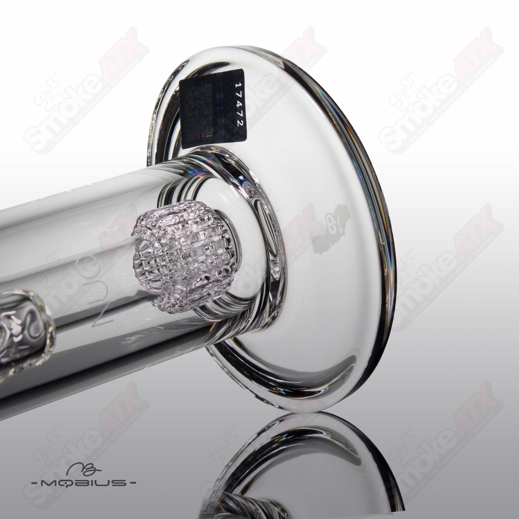 Nuc Matrix Mobius heady glass bubbler with intricate glasswork and clear design, featuring a compact, artistic smoking device.