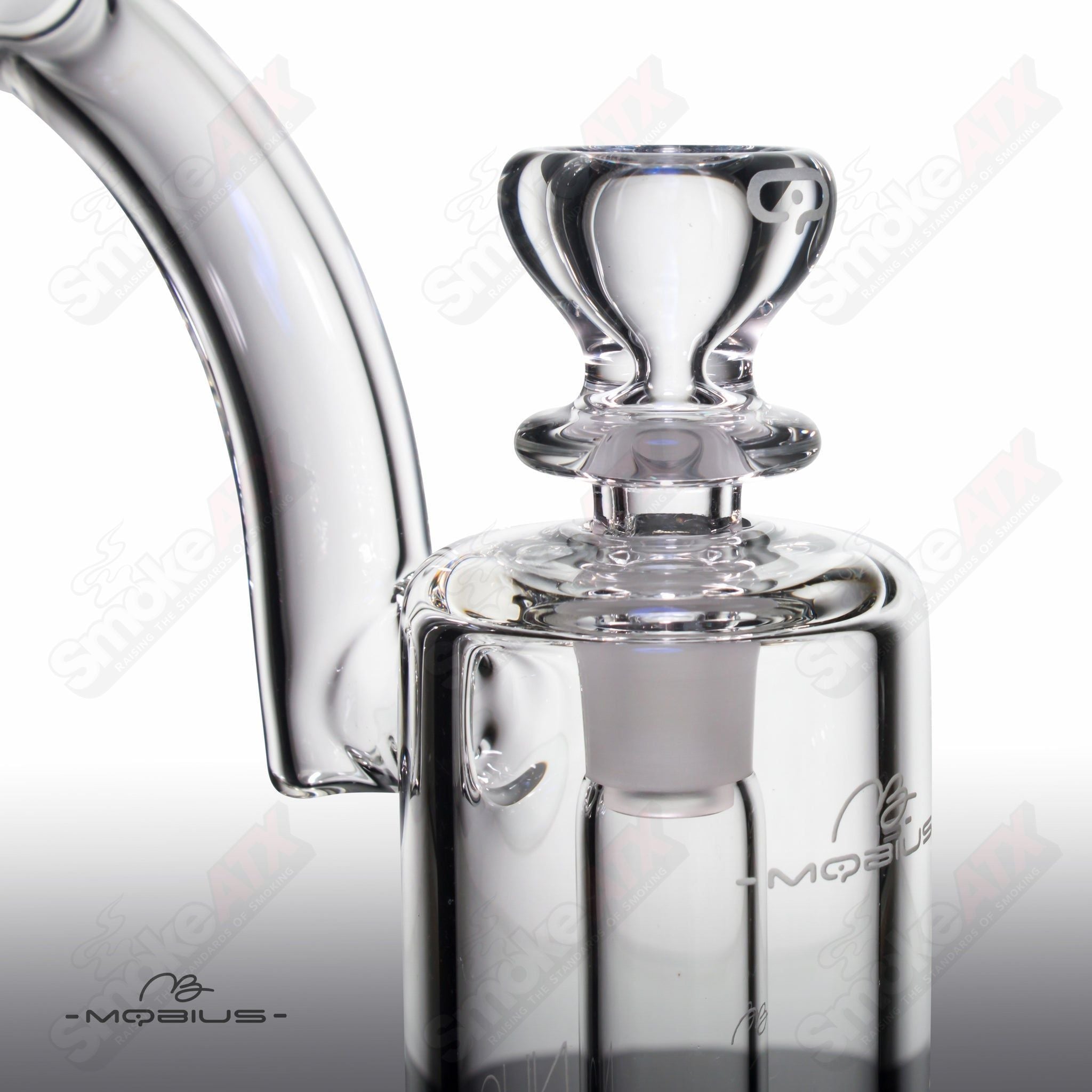 Heady glass Nuc Matrix Mobius bubbler with intricate design and clear glass, showcasing its artistic craftsmanship and functional style.