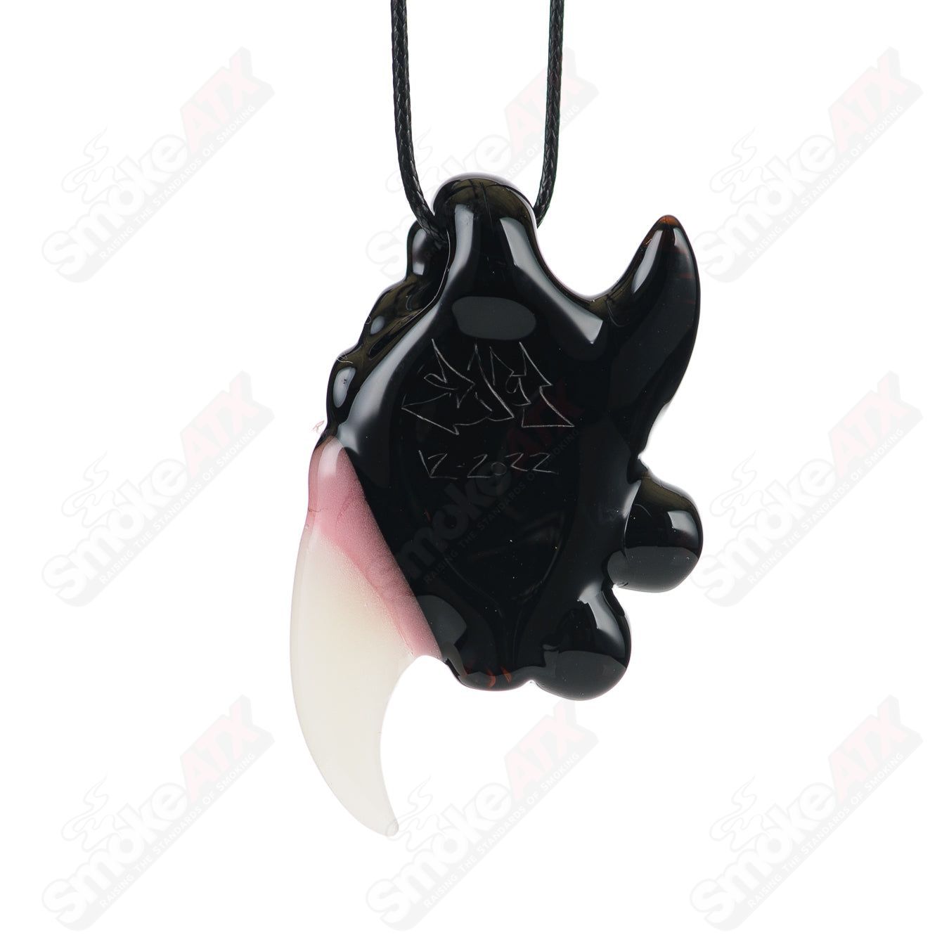 Black Jack pendant by Salt Glass, a high-quality heady glass pendant with intricate black and clear design details.