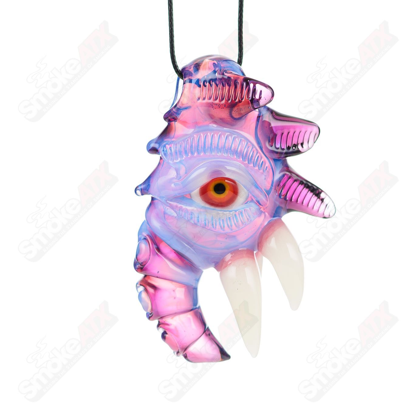 Gold and amethyst Lucid pendant from Salt Glass with intricate glasswork, hanging from a sleek chain, showcasing vibrant colors and craftsmanship.
