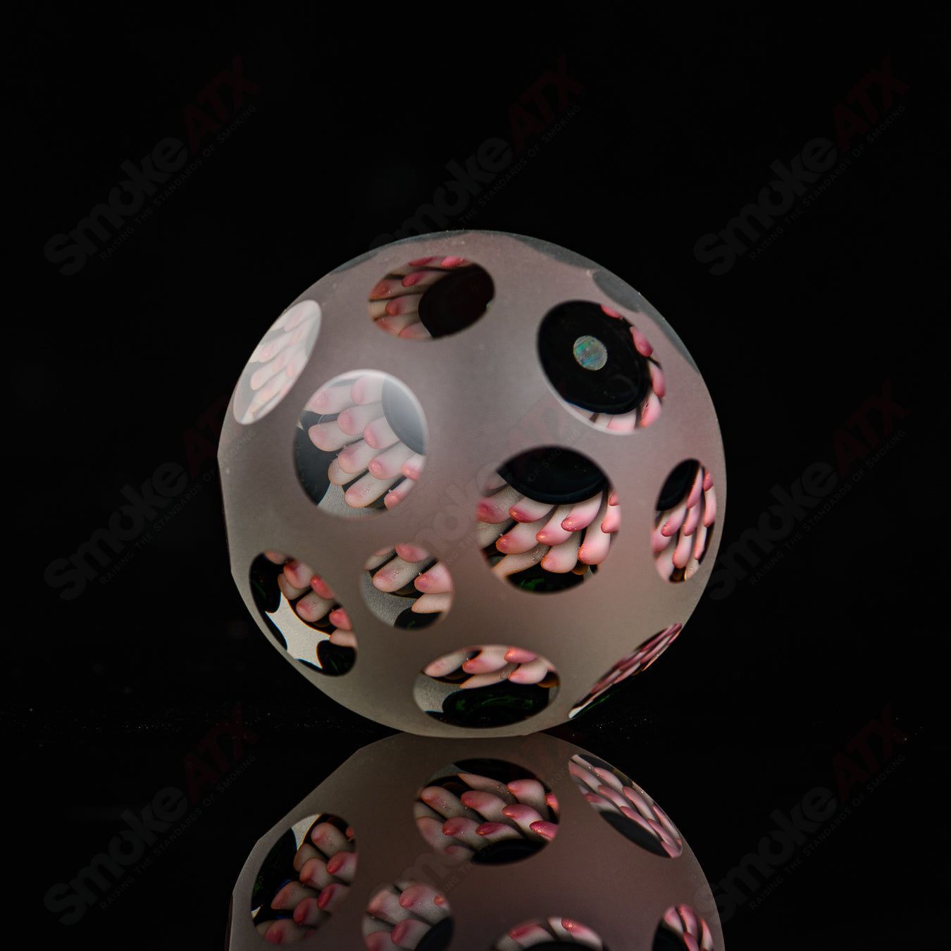 Pink faceted marble Raj K glass from Raj Kommineni Glass, a vibrant heady glass marble with detailed faceted design.