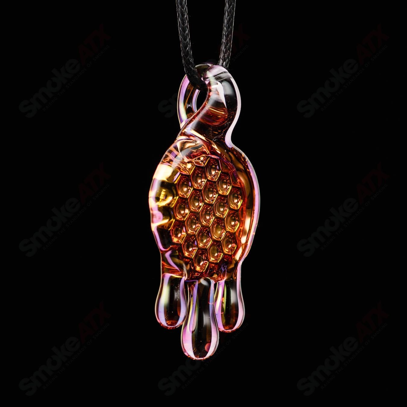 James Lang pressed honeycomb pendant made of glass, showcasing a detailed honeycomb pattern in a jewelry pendant design.