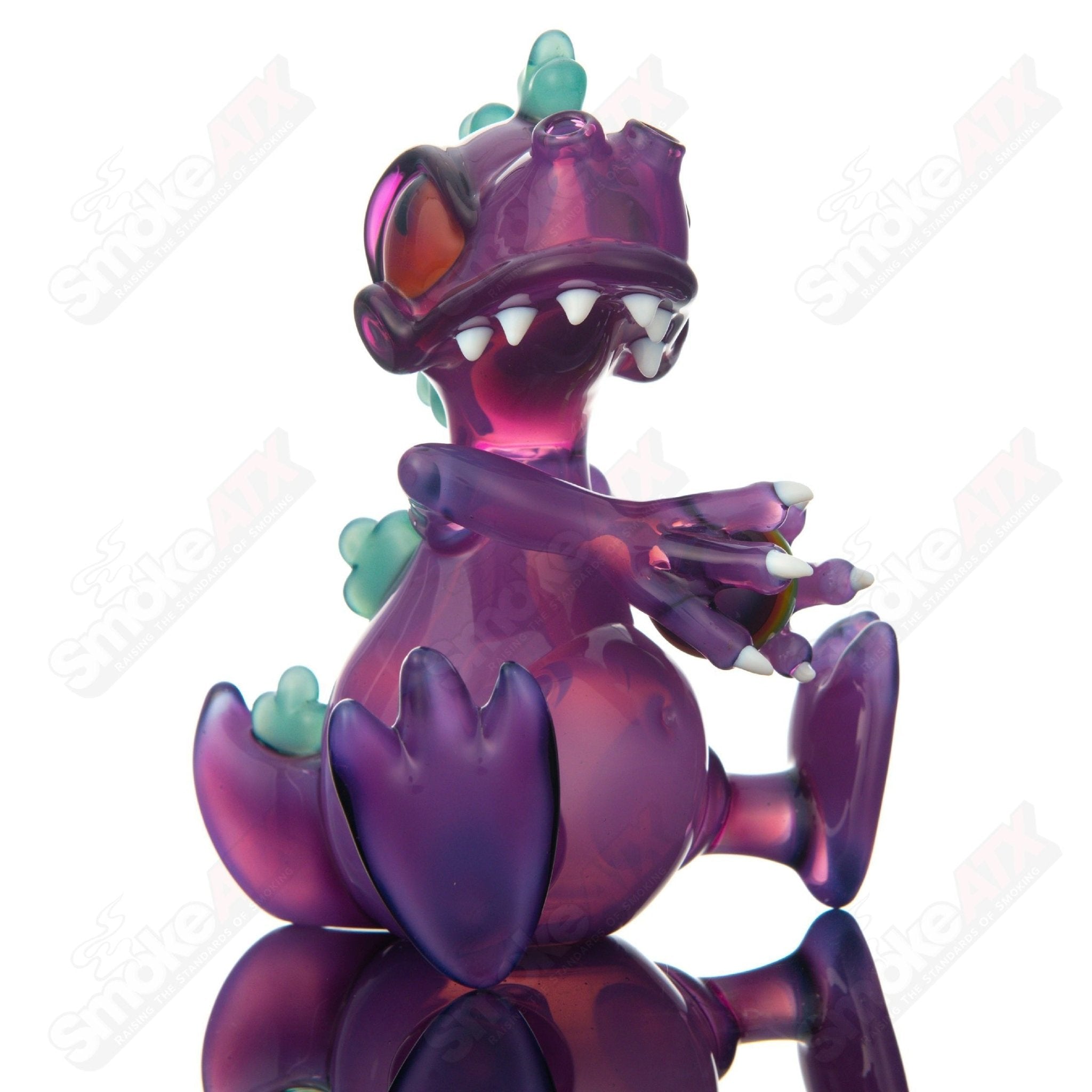 Purple Reptar sitting concentrate rig with encalmo egg detail by J-Smart Glass, heady glass design for dabbing and concentrates.