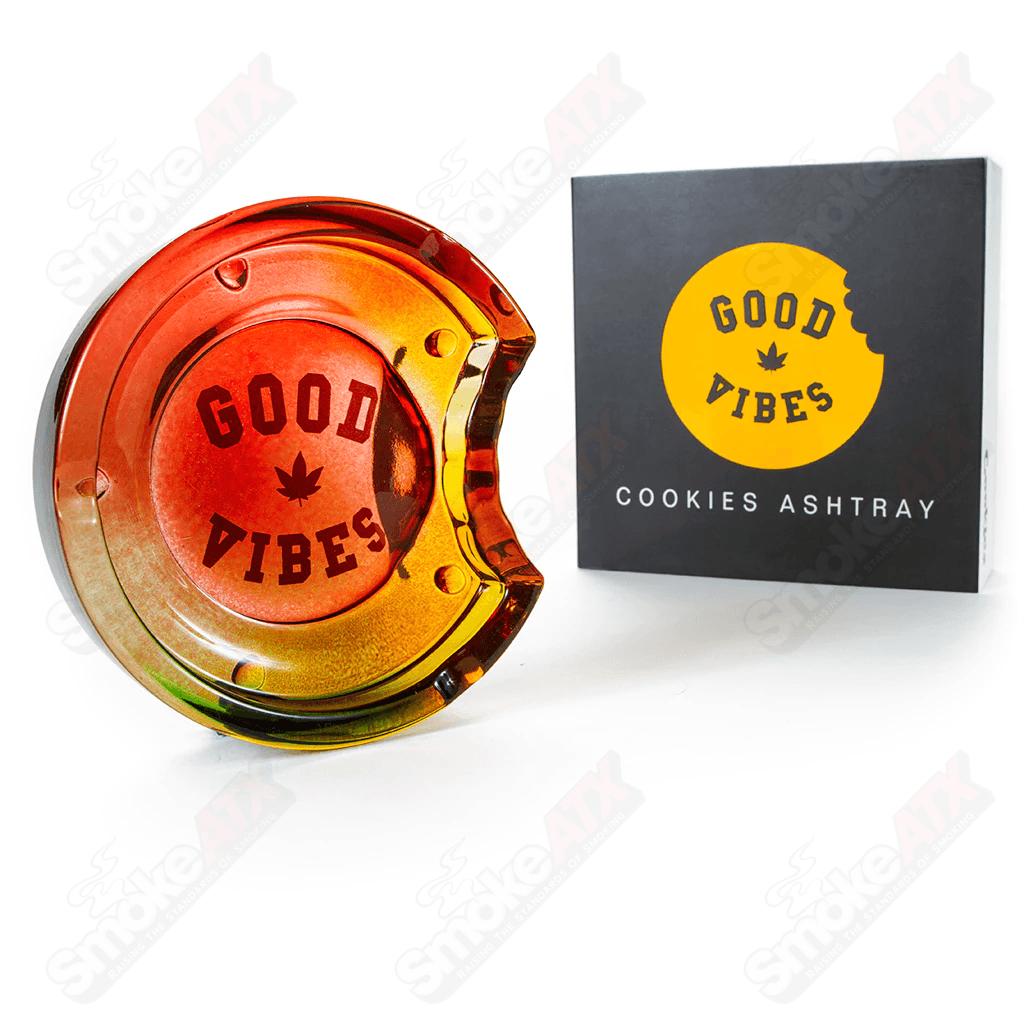 Rasta C Bite Cookies ashtray with colorful Rasta design, featuring Cookie's branding, used for holding ashes and smoking accessories.