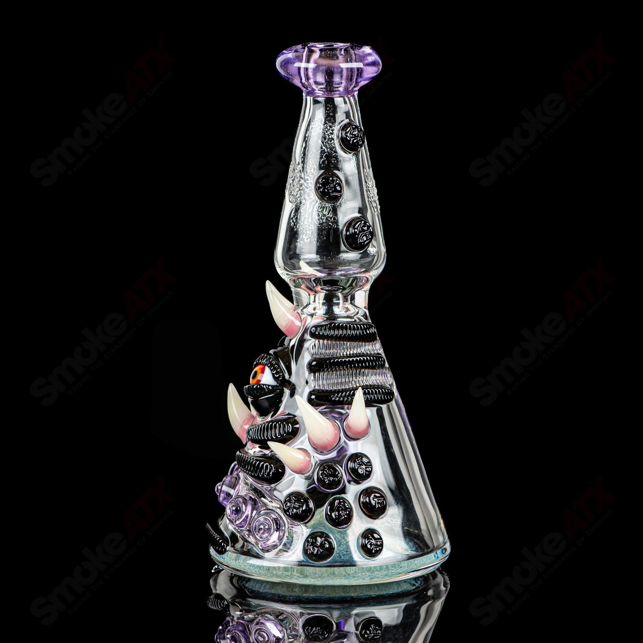 RipCurl by Helix & Salt Glass heady concentrate rig with intricate glasswork, showcasing vibrant colors and detailed design.