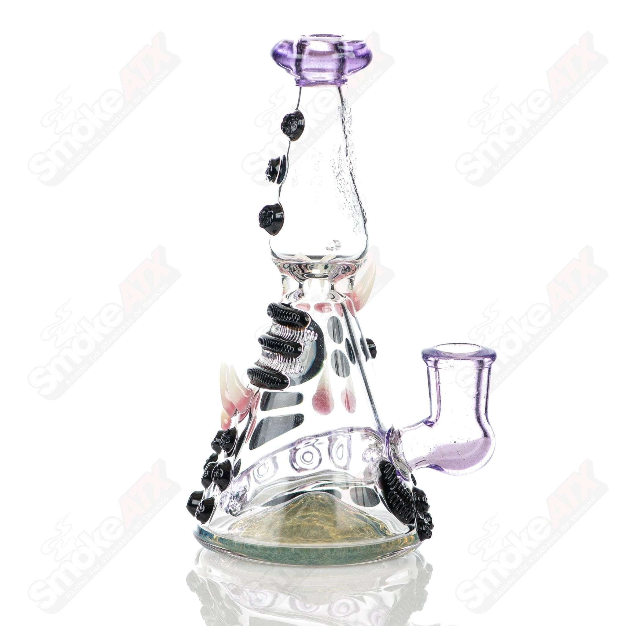 RipCurl by Helix & Salt Glass heady concentrate rig with intricate glasswork and vibrant design for dabbing and concentrate use.