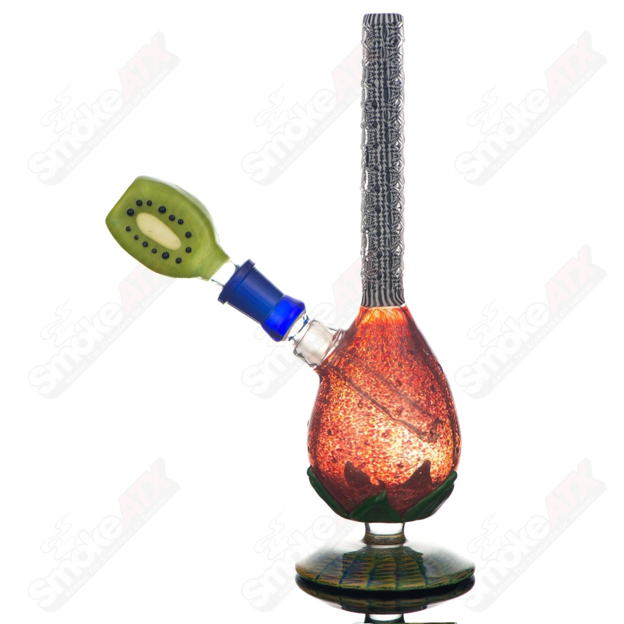 Heady glass concentrate rig featuring a straw and kiwi design by Stoke x Boots, with intricate glasswork and vibrant colors.
