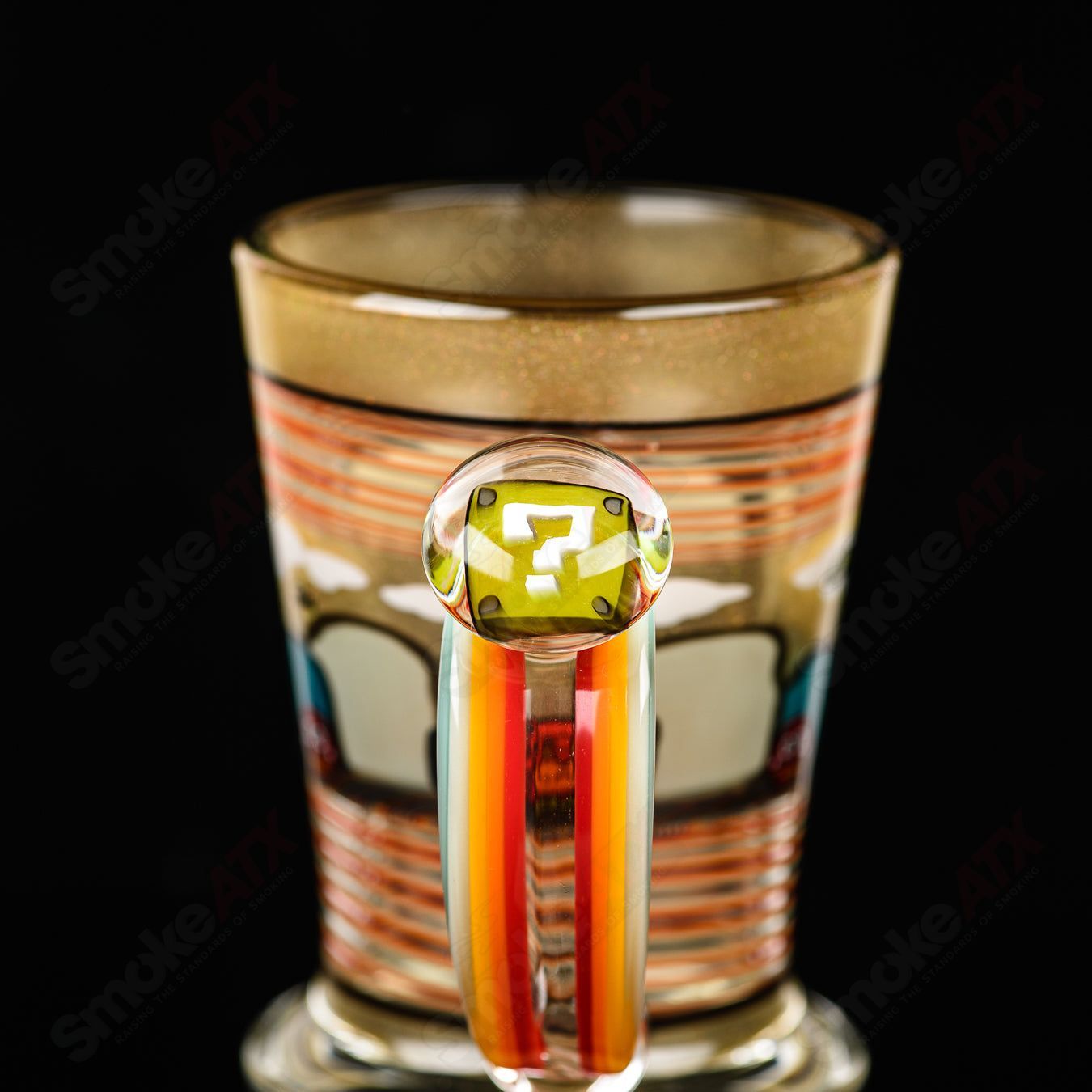 Super Mario-themed Milli coffee mug by Micro & SPG, clear heady glass cup with Mario graphics and vibrant colors.