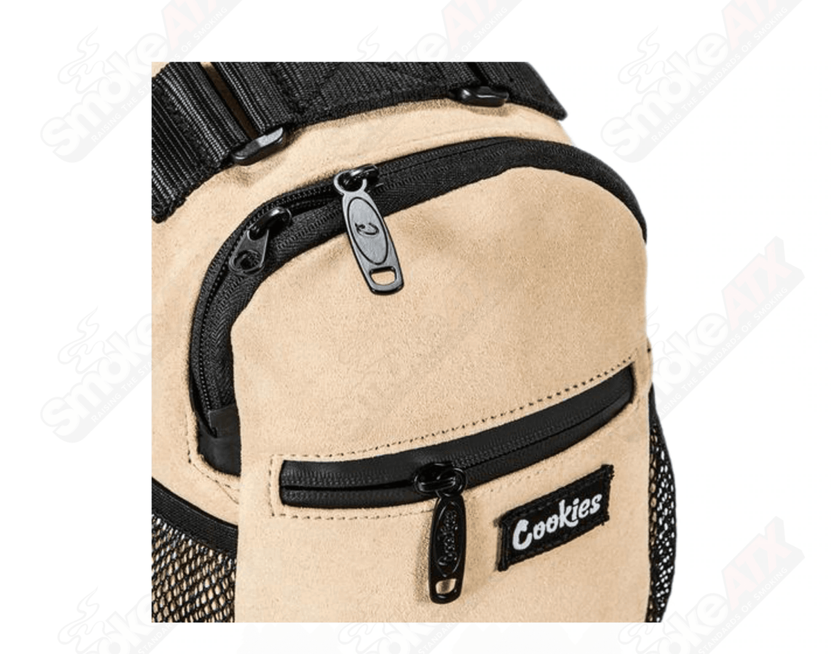 Tan suede Cookies sling bag with adjustable strap, stylish lifestyle bag made from soft suede material.