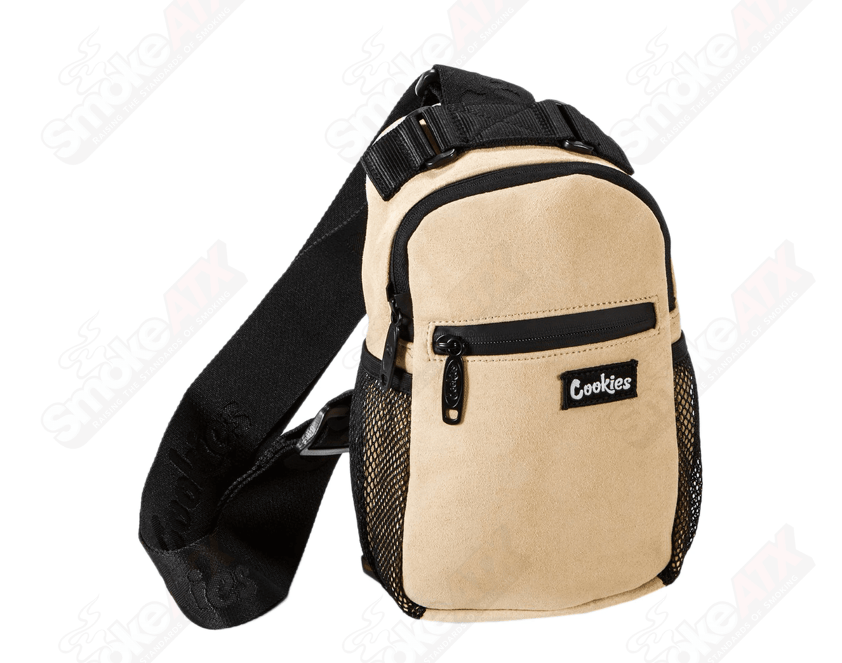 Tan suede Cookies sling bag with a sleek, minimalist design for everyday use, featuring a stylish adjustable strap.