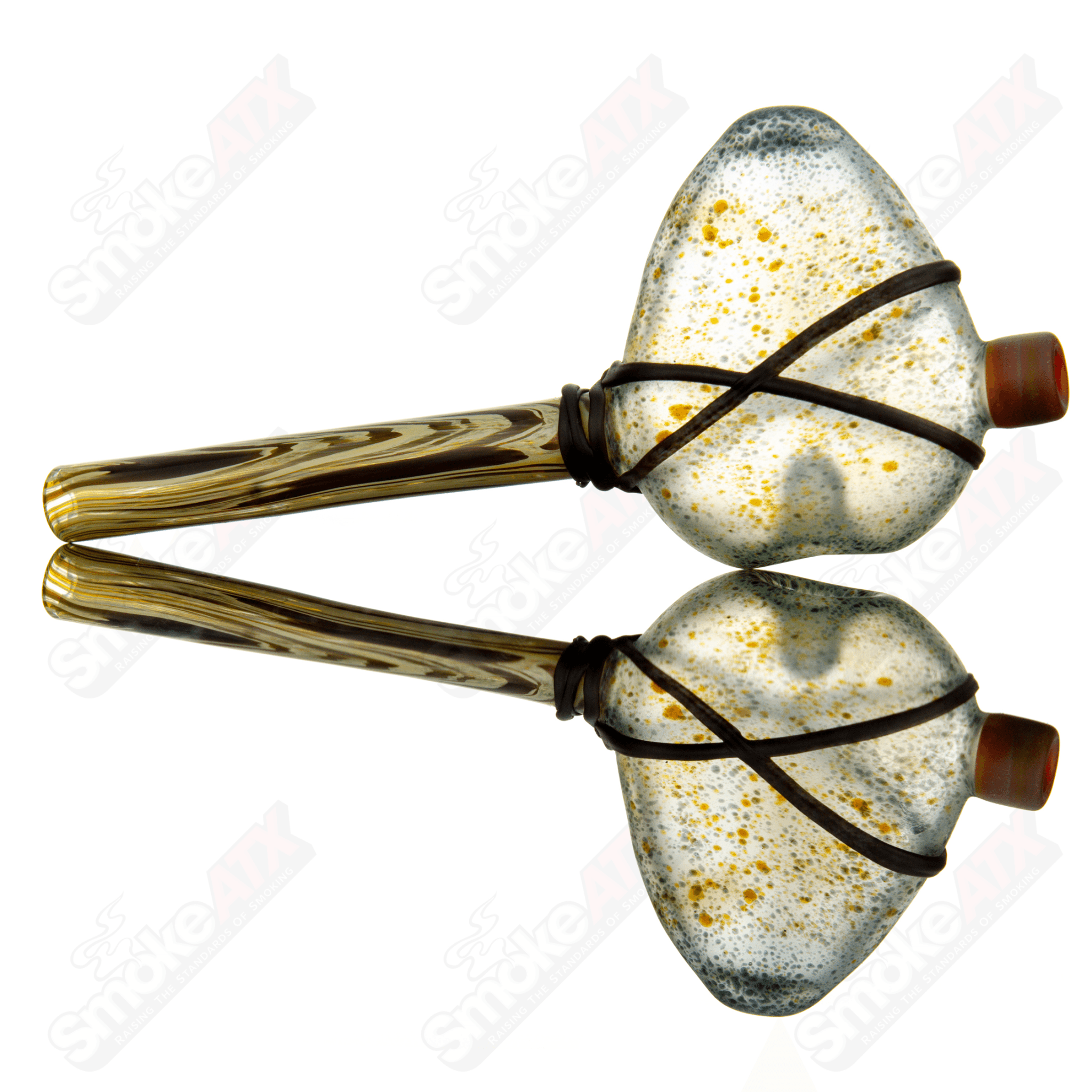 Chad G Glass Tomahawk Pipe, a hand pipe with a unique tomahawk design, made of clear and colored glass.