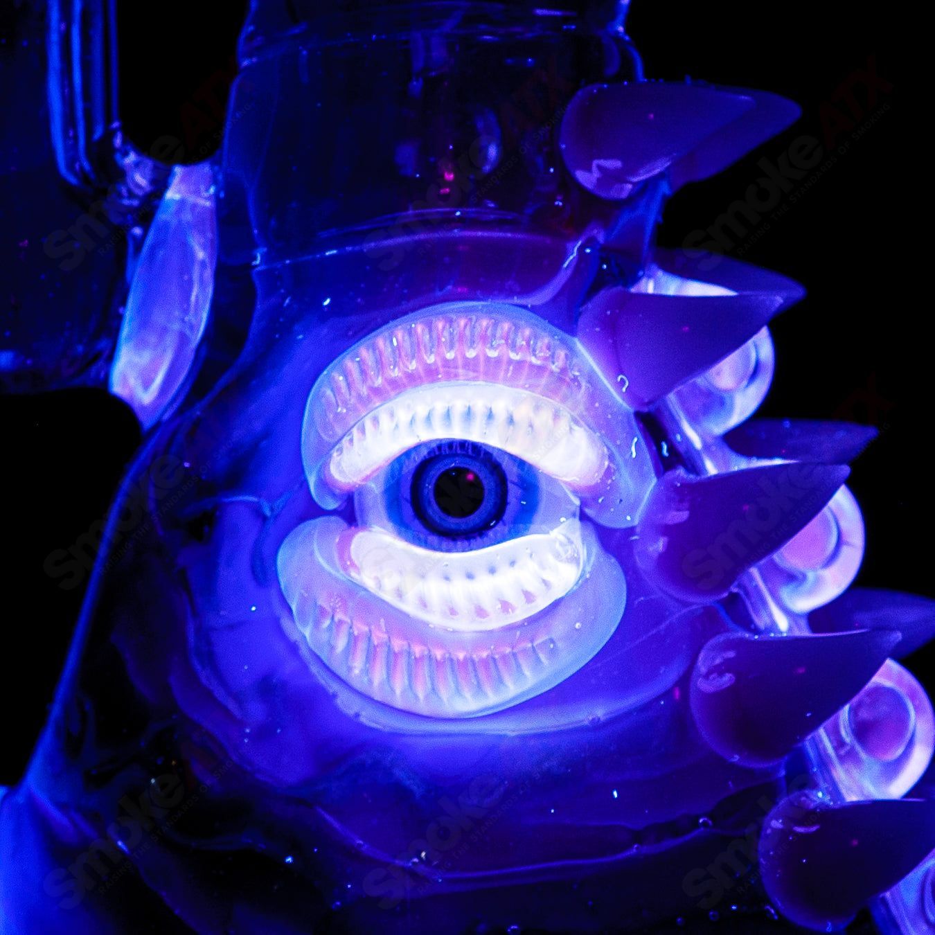 UV tie-dye glass Soul Flask by Salt Glass, a colorful heady glass concentrate rig with vibrant tie-dye design.