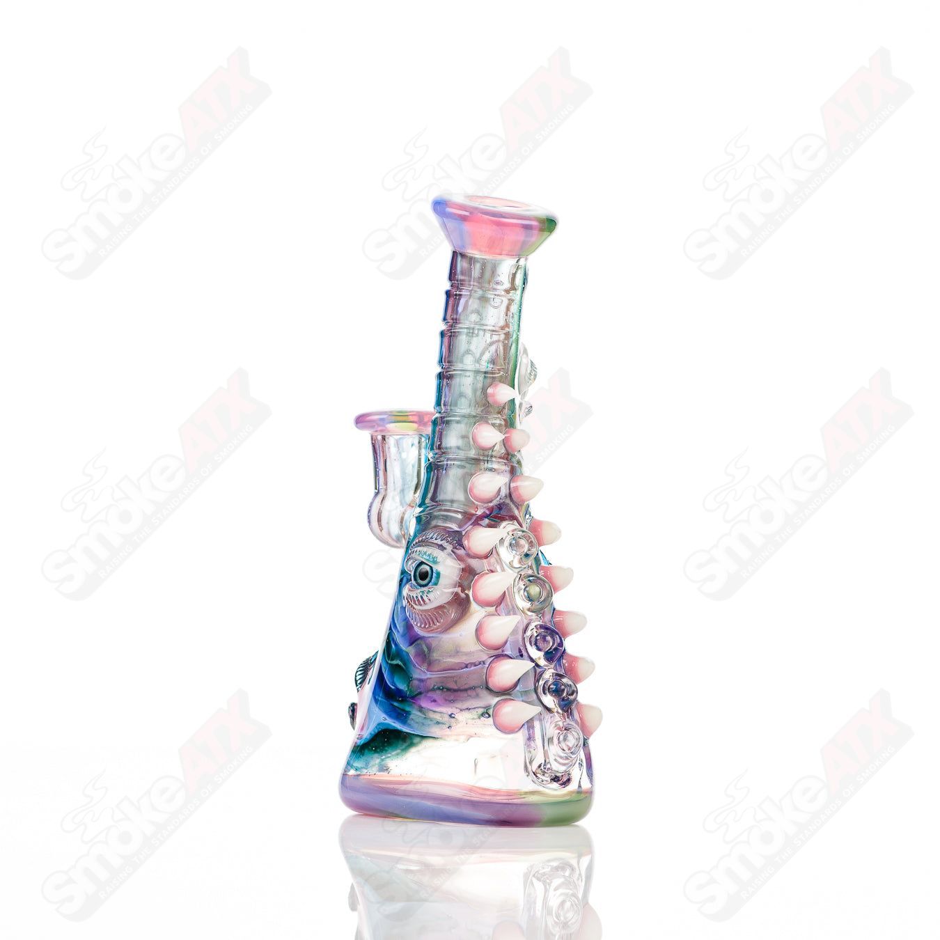 UV tie-dye Soul Flask glass by Salt Glass, a colorful heady concentrate rig with vibrant tie-dye pattern and glass craftsmanship.