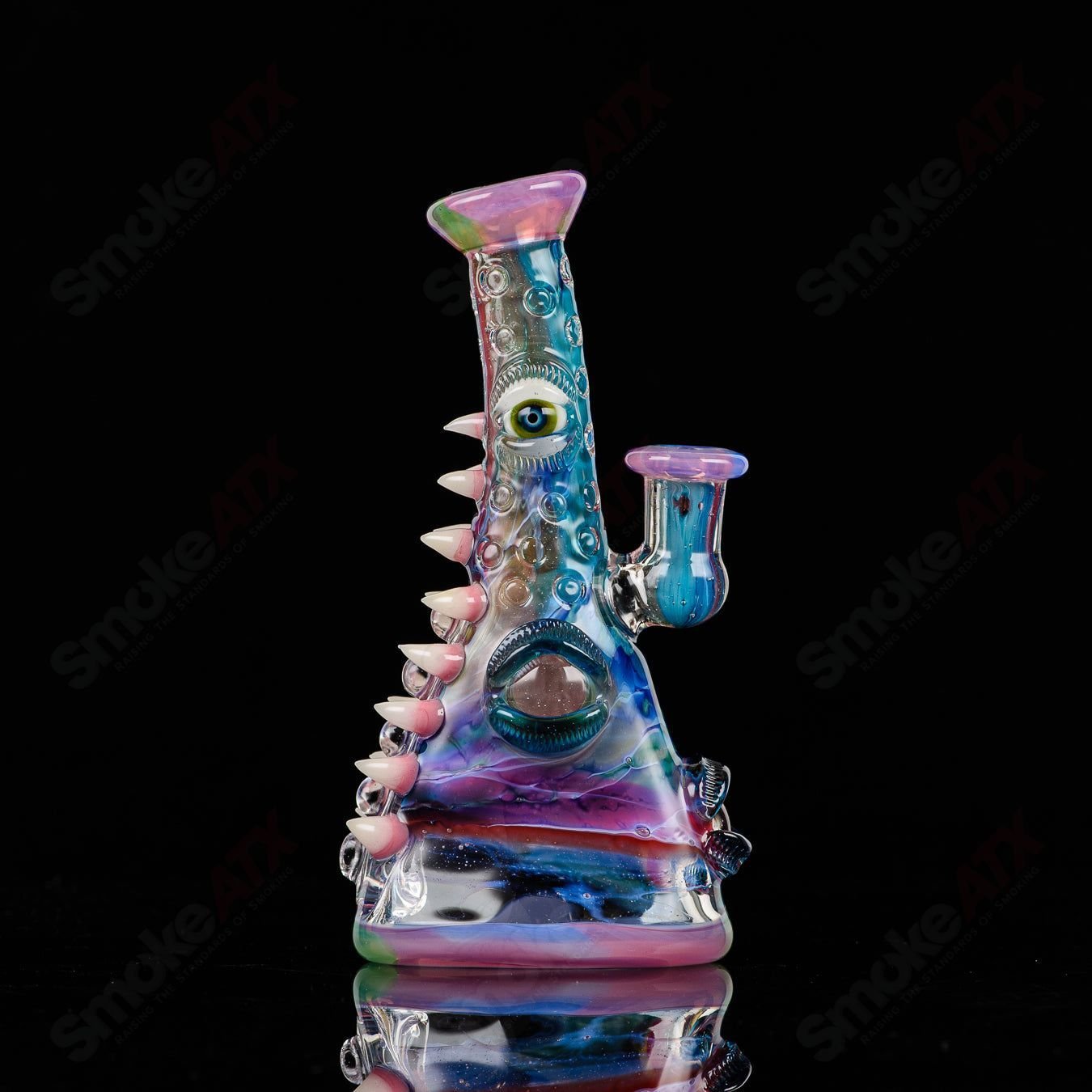 UV tie-dye glass Soul Flask by Nobody x SALT, a colorful heady glass concentrate rig with vibrant tie-dye design.